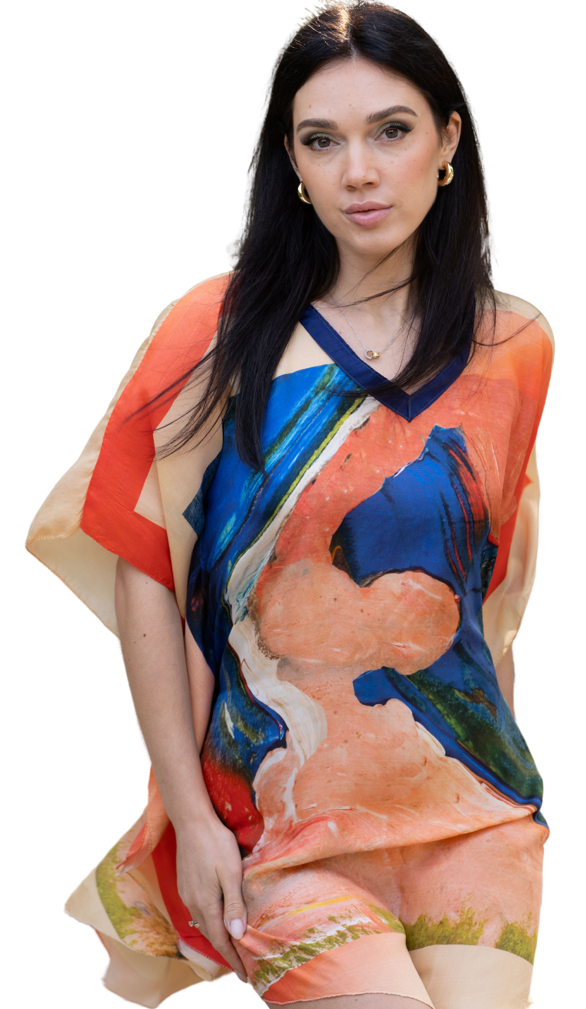 A female model wearing a multicolored silk wrap with a design that resembles two whales playing together.